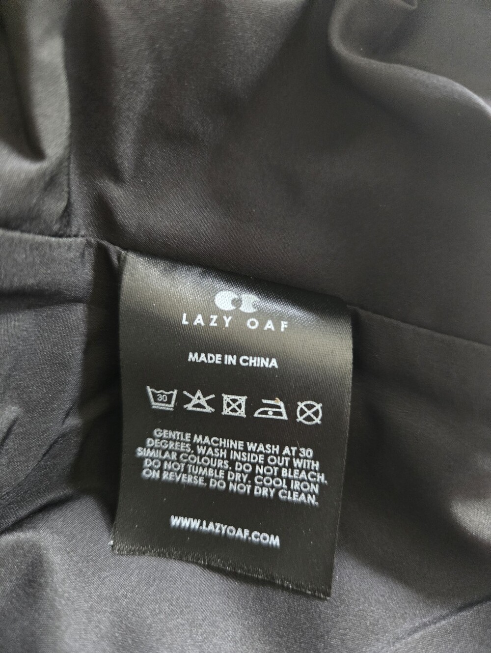 NWT! Lazy Oaf Happy Sad Reflective Print Longline Puffer Coat. Size S - Picture 16 of 16